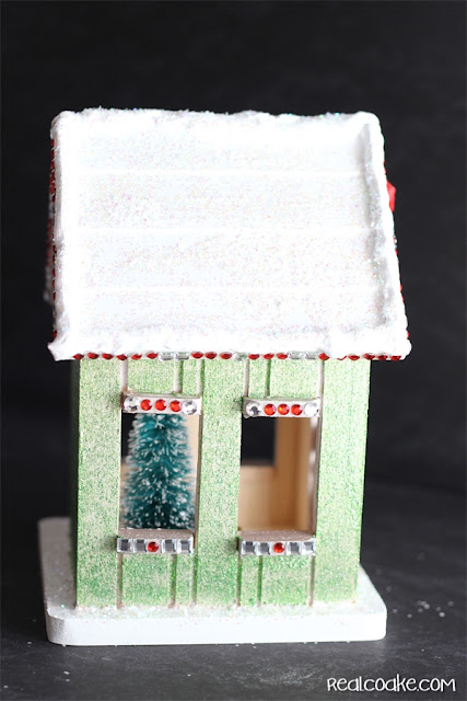 A DIY Christmas Craft to make a cute wood Gingerbread House from realcoake.com