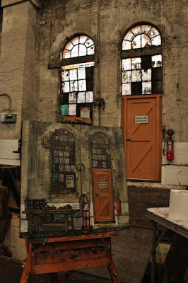 Plein air oil painting of windows in the interior of the Large Erecting Shop in the Eveleigh Railway Workshops painted by industrial heritage artist Jane Bennett