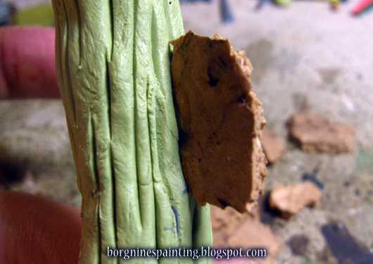 Closeup on the cork inserted, by the edge, into the milliput-greenstuff mix.