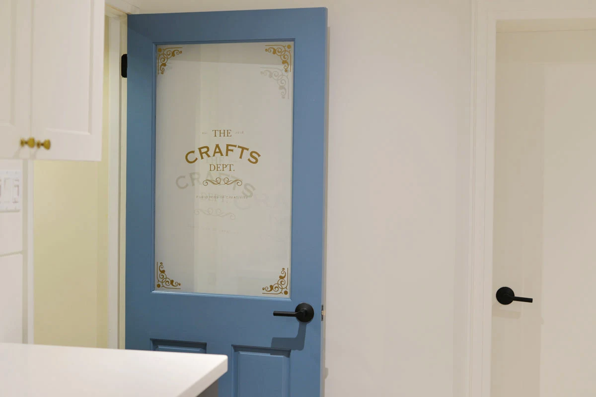 craft room door | behr blue moon bay | door decal