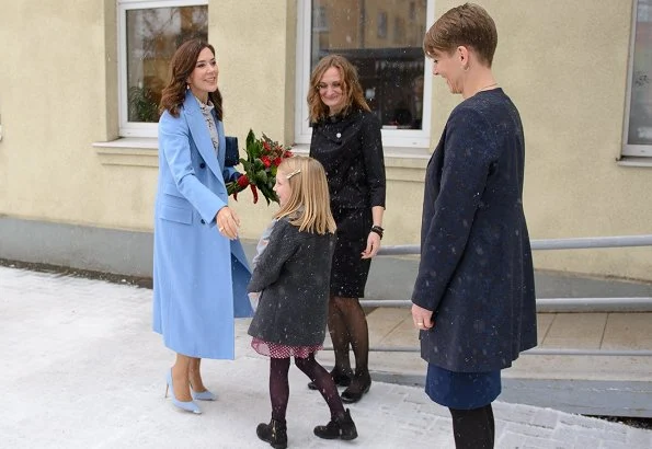 Crown Princess Mary wore Stine Goya blouse, Ralph Lauren wool coat, Gianvito Rossi Pumps and carried Quidam clutch