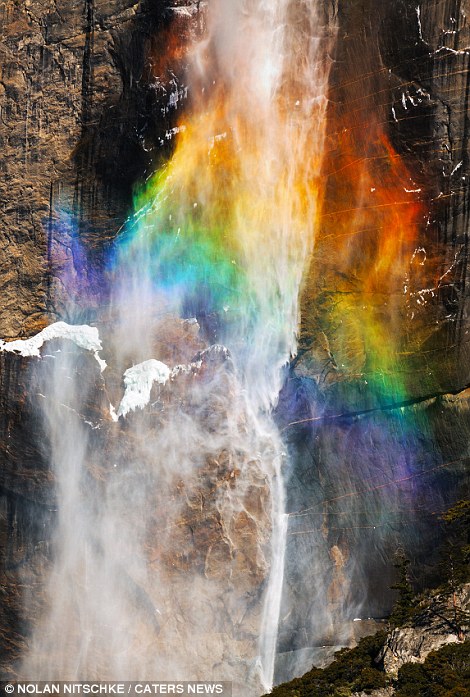 Lightning strikes rainbow at Yosemite Park 