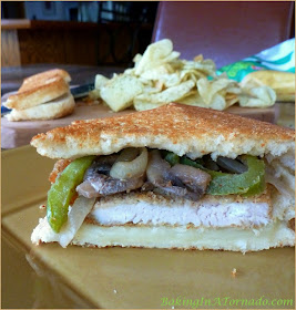 Breaded Turkey Cutlet Grilled Cheese, a smoky grilled cheese sandwich made with a breaded pan fried turkey cutlet and accented with sauteed vegetables | Recipe developed by www.BakingInATornado.com | #recipe #turkey #sandwich