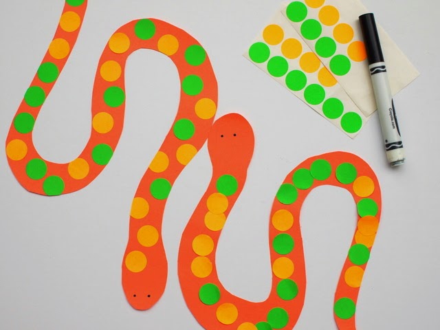 decorate snakes with circle stickers and markers