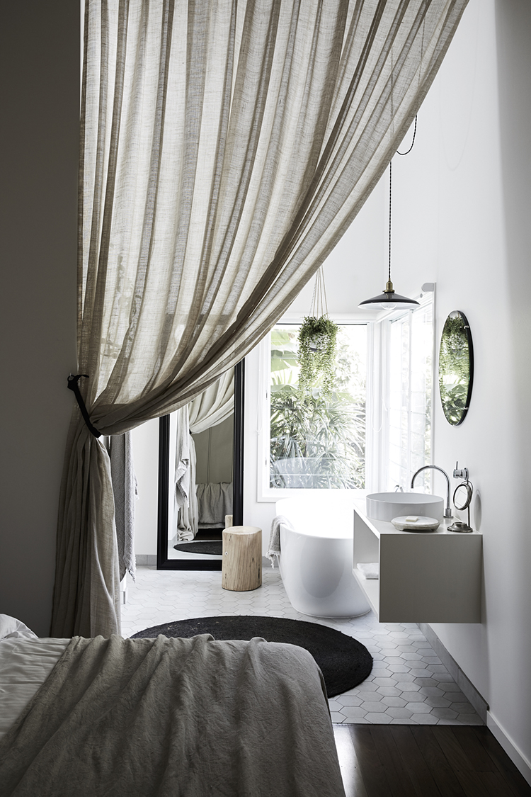 5 things that curtains can hide inside a bedroom | The bathroom. Photo via Byron Beach Abodes