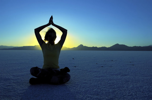 Woman in desert for triangle meditation