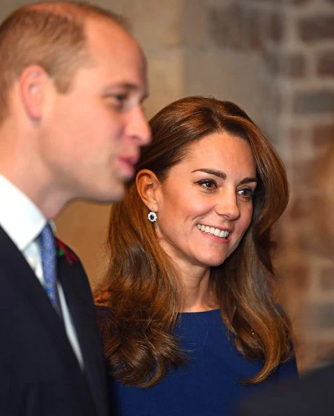 Kate Middleton wore Emilia Wickstead Kate a-line wool crepe dress in navy blue. Poppy Collection the first world war diamond brooch