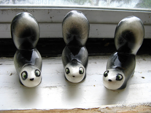 Vintage skunk figurines