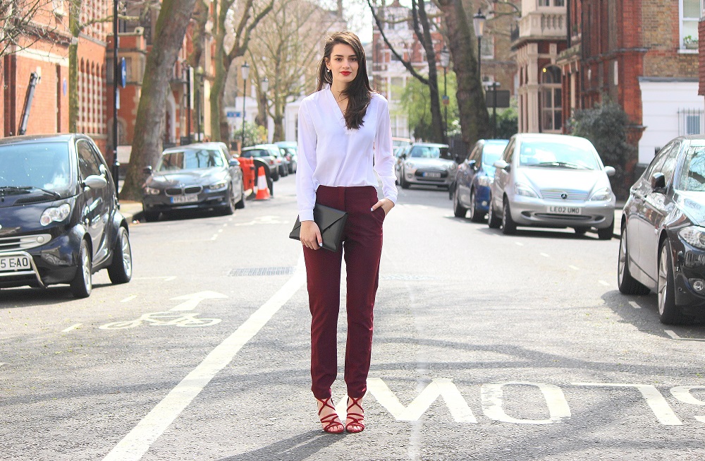 peexo fashion blogger wearing smart trousers and white blouse with strappy sandals