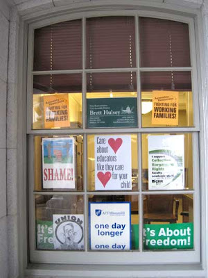 Large window with pro-union signs in every pane