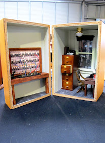 Wooden box containing a one-twelfth scale miniature telephone exchange and office.