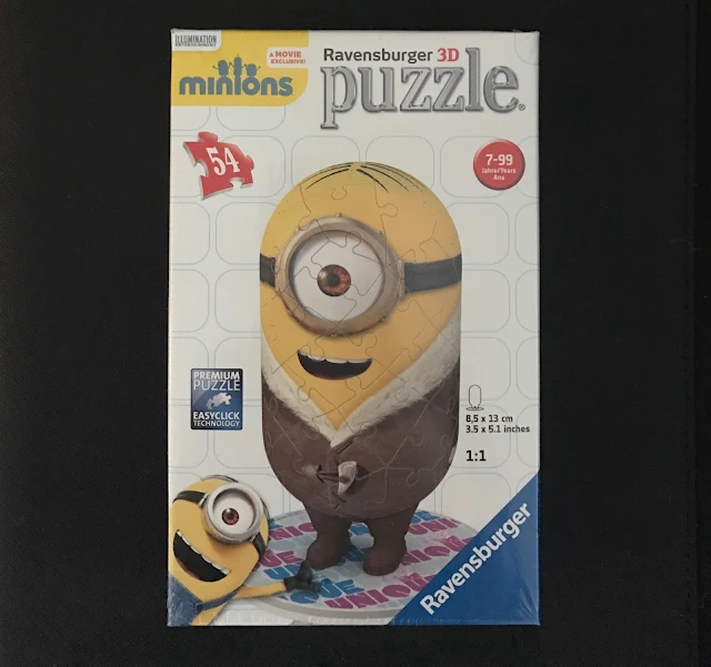 A box with a 3D Minions puzzle showing a minion in a fur coat