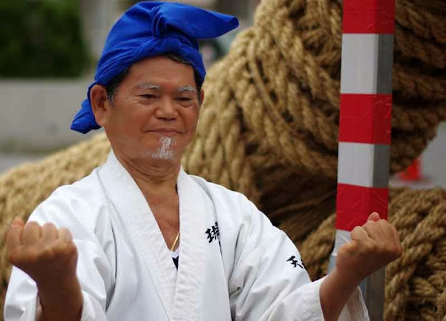 Karate Master poses by Tug-O-War rope