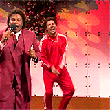 gif result for best funny christmas gif SNL red track suit Jason Sudeikis