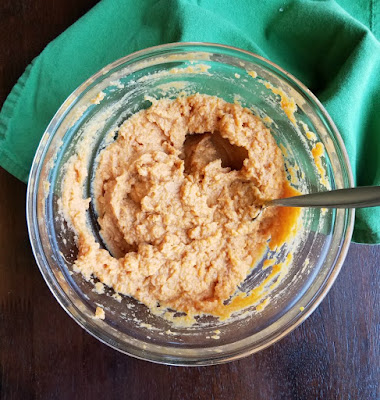 mashed sweet potato mixture in glass mixing bowl, ready to make duchess sweet potatoes