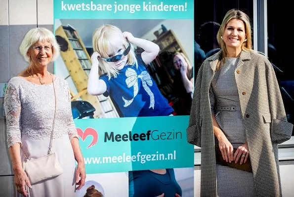 Queen Maxima recycling a Natan combination of dress and coat