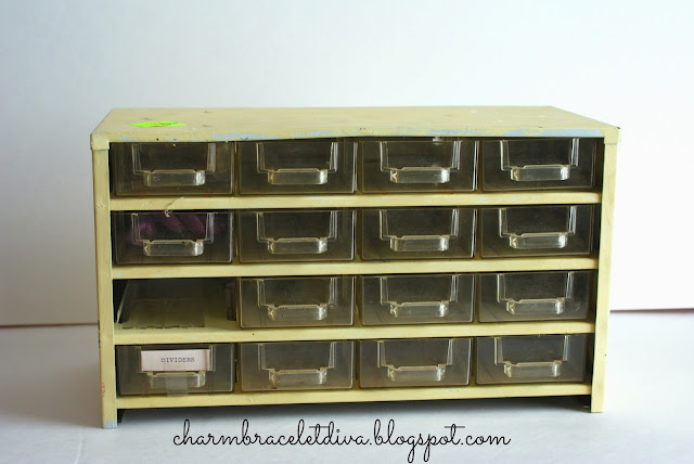 yellow metal tool box with plastic drawers