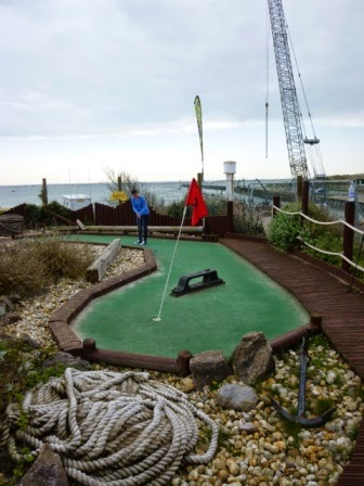 Emily on hole four of the Sharksville Adventure Golf in Littlehampton