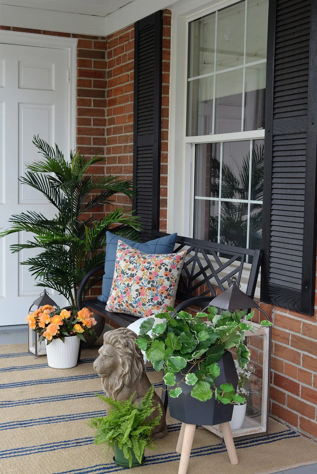 front porch decorated with artificial outdoor plants