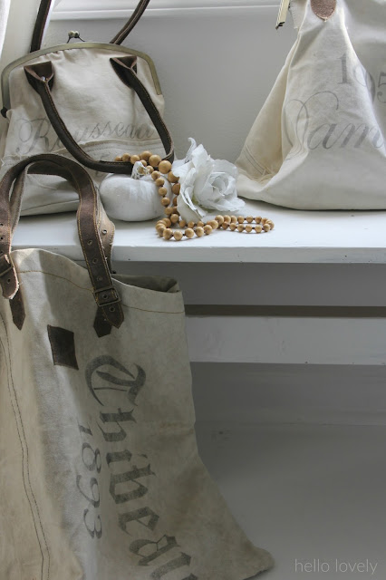 Vintage inspired French handbags in cozy fall vignette by Hello Lovely studio