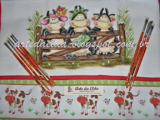 trio de vaquinhas na porteira