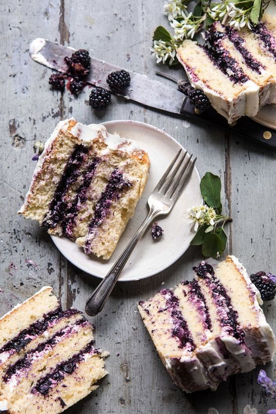 Blackberry Lavender Naked Cake with White Chocolate Buttercream. Four layers of light and fluffy vanilla cake with homemade blackberry lavender jam, and white chocolate buttercream. This cake is nothing short of delicious. Every bite is layered with fresh berries, hints of lavender, and sweet vanilla cake. The perfect berry filled cake for any and all occasions.