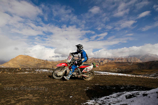 Raid de Himalaya is one of the premier Motorsports event in India, which starts form Shimla, Himachal Pradesh and concluded at Shrinagar (Jammu & Kashmir) after 8 days of action filled days in himalayas. This Photo Journey shares some of the wonderful photographs by Motorsports Photographer Varun Chadhary who has been covering many other Motorsports rallies in India. Let's check out and explore more about Raid De Himalaya action from 2012...Varun has shared lot of wonderful Photo Journeys in past and one of the wonderful Motorsports Photographer in the country. The 14th Maruti Suzuki Raid-de-Himalaya started from Shimla and after that rally/participants traversed a distance of 1800 kms over a span of six days. Raid de Himalaya 2012 was flagged off from Peter Hoff Hotel which is located in Chaura Maidan region of Shimla Town in Himachal Pradesh.The 14th Maruti Suzuki Raid-de-Himalaya was concluded at Leh. Suresh Rana and Parminder Thakur were adjudged the winners of the X-treme 4Wheel category and C.S. Santosh was declared as the winner of the Xtreme 2Wheel categoryK. Prasad and M. Chandrashekhar were declared the winners in the Adventure 4Wheel category. In all, 17 teams in the X-treme 4Wheel category, 40 teams in the 4Wheel Adventure category and 20 bikers could reach the final leg that concluded at Leh.Mahindra XUV500 at 14th Raid de Himalaya 2012 !!!The Moto Xtreme category which is the toughest of the lot is open only to those 4-wheeler drivers who have prior rallying experience and who have competed in one of the earlier editions of the Maruti Suzuki Raid-de-Himalaya. 50 teams participated in the Moto Xtreme 4-wheeler category in this year's event.Mahindra XUV500 splashing out the water on Himalayan terrains during 14th Raid de Himalaya.KTM Duke Motorbike riding through one of the roughest and tough terrains of Himalayas during 14th Raid De Himalaya 2012...Maruti Jypsy crossing through snow covered hills under shining sun and blue sky on the top. A wonderful Click by Varun Chaudhary during 14th Raid De Himalayas 2012Varun is really keen in clicking biker photographs during these motorsports rallies which is quit opposite to many of the other photographers in this areaRaid de Himalaya terrain includes -  Darcha (3360 mts), Keylong (3440 mts), Leh (3524 mts), Kaza (3650 mts), Dhanka (3894 mts), Losar (4079 mts), Rumtse (4300 mts), Kunzum La (4551 mts), Komik (4587 mts), Pang (4600 mts) & Wari La (5313 mts)The Maruti Suzuki Raid-de-Himalaya usually invites participation in three categories: Moto Xtreme, Adventure Trial and Bike Xtreme categories. The participants are grouped in different categories depending upon their prior experience, endurance levels and expertise in handling the escalating difficulty levelsShiny RED Gypsy surrounded by snow covered hills and bright blue sky during 14th Raid de Himalayas 2012 !!On the final ceremony, Mayank Pareek, Chief Operating Officer, Marketing and Sales, Maruti Suzuki, said, 'It was a tough and perilous journey and the winners showed great acumen, stamina and dexterity. This year, we had undertaken a number of extra safety measures like putting in service a helicopter to ensure timely help to rallyists in case of emergencies.' Raid de Himalaya is a test of a competitor's dexterity in handling rough roads, uncertain and extreme weather conditions and the strength and endurance of his vehicle