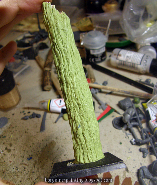 The milliput-greenstuff around the stick has now the texture all around, while retaining some of the deep crevices left by the sculpting tool.