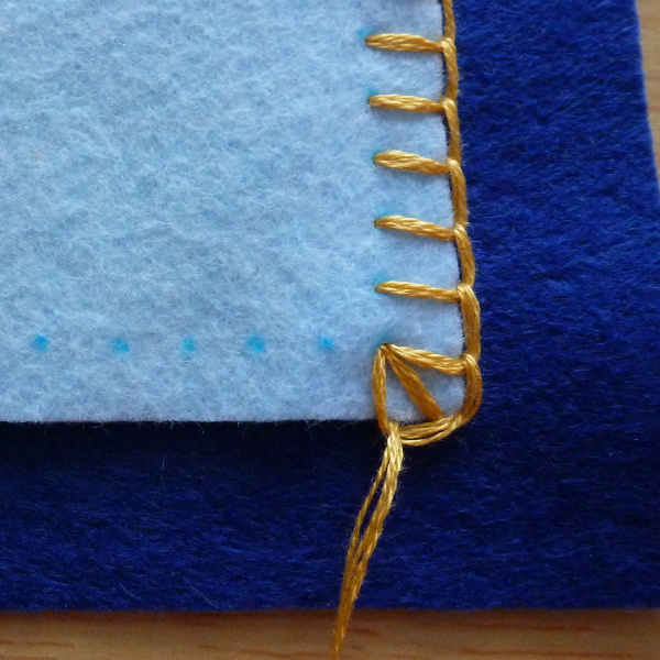 Blanket stitch corner close up photo example how to instructions