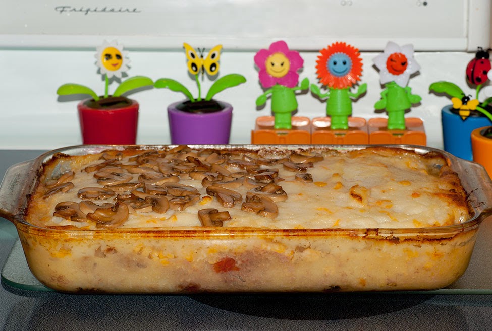 Baked dish of italian flavoured shepherd's pie with mushrooms.