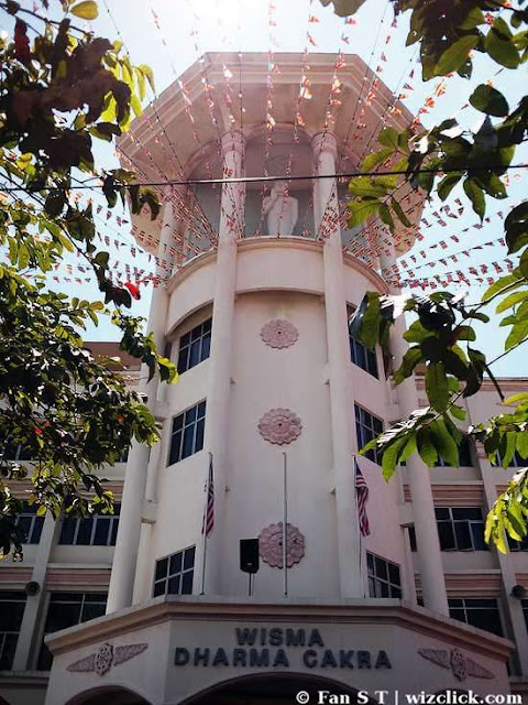 Buddhist flags hanging from the top of Wisma Dhama Cakra Buddhist flags hanging from the top of Wisma Dhama Cakra