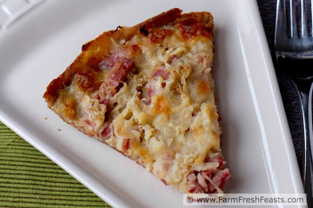 Ball park flavors in a home made pizza. This pie takes the sausage & sauerkraut combo and tops it with smoked mozzarella for a new twist on pizza night.