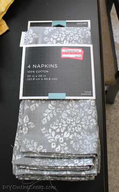 Turn these cloth napkins into a pillow for under $3.00!