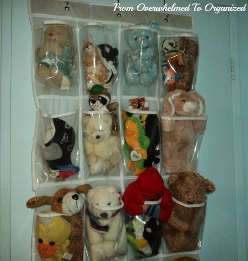 Overdoor shoe bag installed to hold stuffed animals.