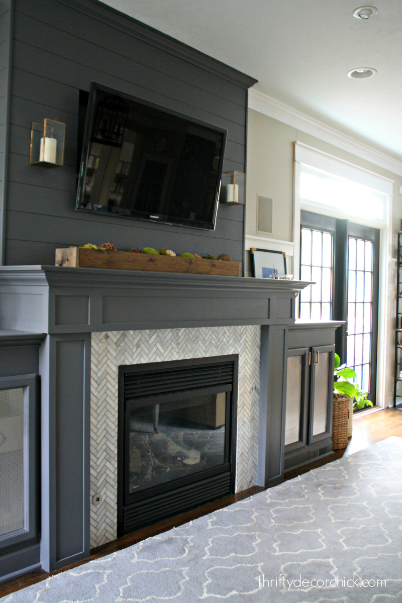 dark gray fireplace herringbone tile