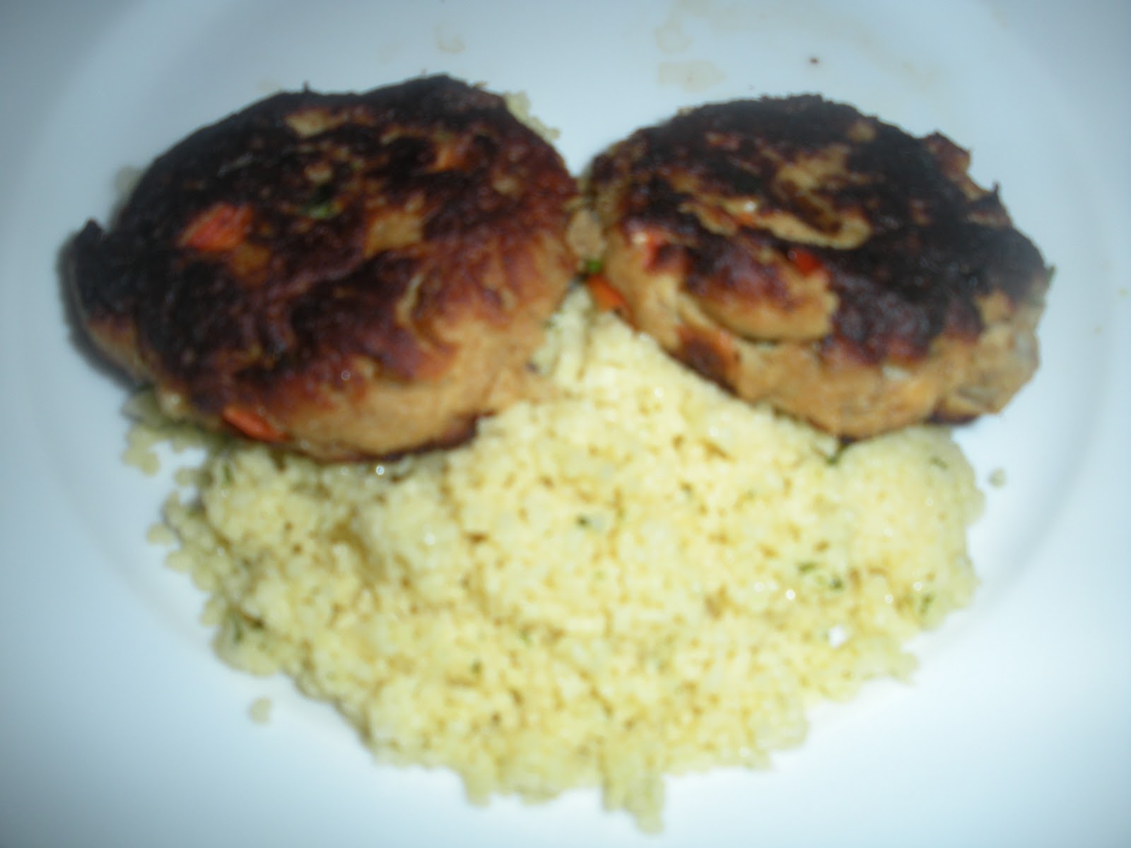 The Kels Pan Fried Salmon Patties on a Bed of Couscous