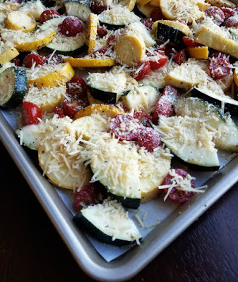 marinated zucchini and tomatoes covered with grated Parmesan ready to roast marinated zucchini and tomatoes covered with grated Parmesan ready to roast