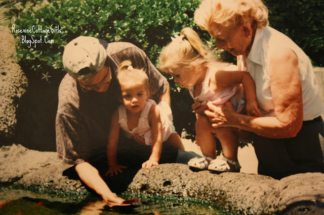 Father showing little girls a starfish grandma holding child | rosevinecottagegirls.com | 22 things you should know | (c)Rosevine CottageGirls