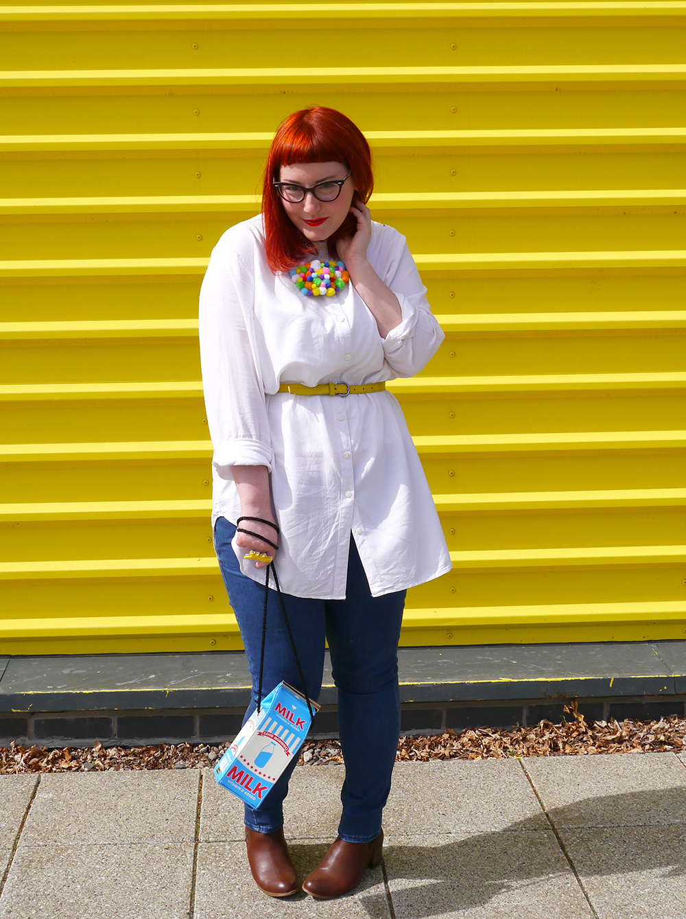 Style dby Helen, Scottish Blogger, red hair, ginger style, cat eye glasses, Dundee blogger, Dundee style, Monki shirt, simple white shirt, blue jeans style, topshop jean, yellow belt. skinny belt, belted shirt, milk bag, novelty bag, Skinnydip London bag, Zara brown boots, brown boots, chelsea boots, pom pom necklace, statement necklace, DIY necklace, handmade style, colourful style, colourful outfit, colourful street style, bright ootd