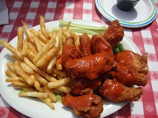 Hot chicken wings, french fries