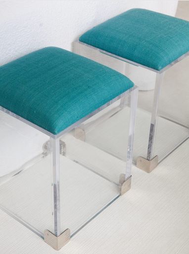 Close up of turquoise and Lucite accent ottoman