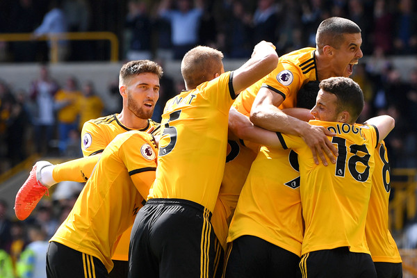 Willy Boly of Wolverhampton Wanderers celebrates after scoring his team's first goal with team mates during the Premier League match between Wolverhampton Wanderers and Manchester City at Molineux on August 25, 2018 in Wolverhampton, United Kingdom. (Aug. 24, 2018 - Source: Shaun Botterill/Getty Images Europe)