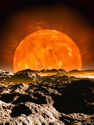 blood red moon over a desert landscape