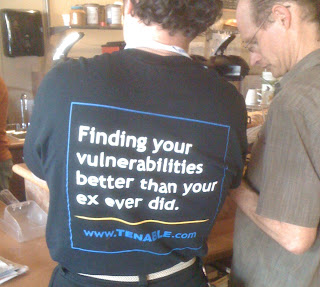 From the back, man in t-shirt from Tenable computer security