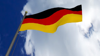 Fotografia da bandeira Alemã - 3 riscas verticais: preto, vermelho e amarelo, começando de cima