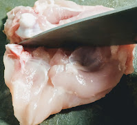 Making incision on chicken thighs with knife Food recipe dinner ideas
