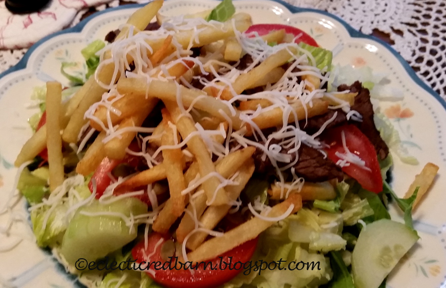 Eclectic Red Barn Pittsburgh Salad with steak and fries and cheese