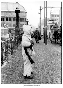 A German soldier stands guard over  bridge centre of Koenigsburg