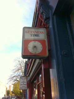  Old advertising sign and clock for "Guinness Time", Greyhound Road, Fulham, London