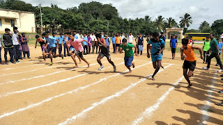 The boys 100m running race - Rajeev Ranjan from BCH in the middle (black and red top)